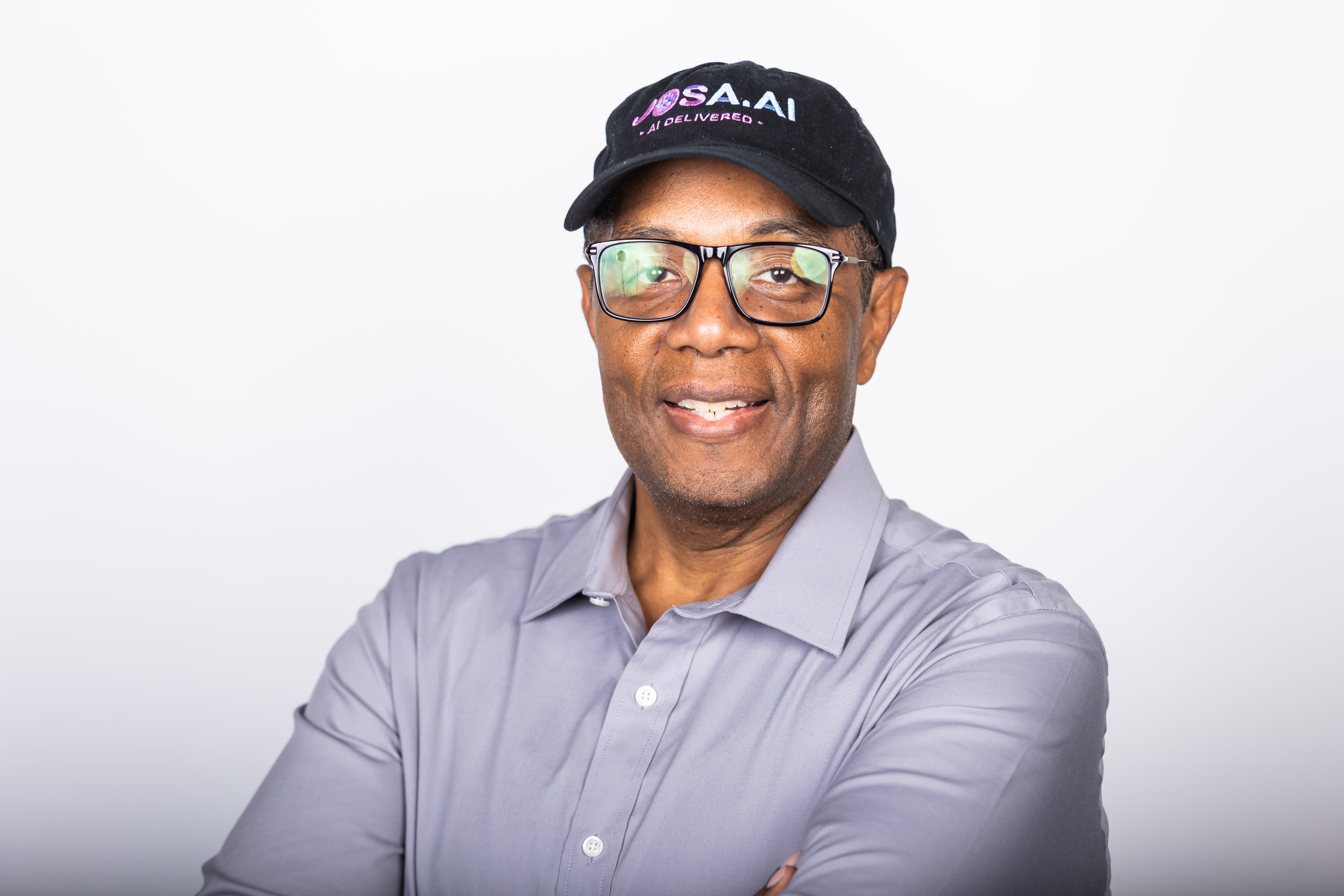 Ernesto Josato, founder of JOSA.AI and AI speaker, wearing his JOSA.AI cap